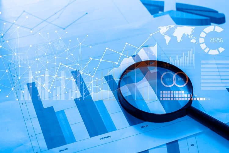 magnifying-glass-documents-with-analytics-data-lying-table